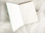 Notizbuch A6 türkis mit Verschluss – Bild 5